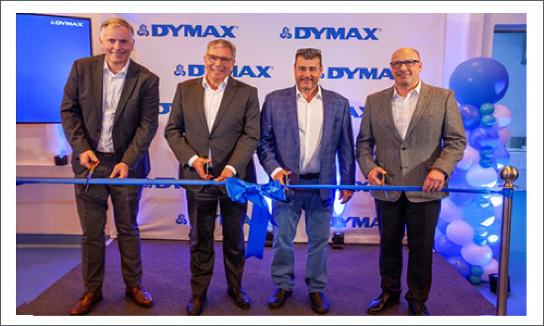 Dymax employees and the Lord Mayor of Wiesbaden cut the blue ribbon at the opening of the Dymax Europe Wiesbaden, Germany facility expansion.
